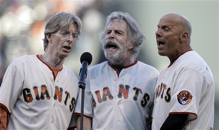 Jackie Greene and Bob Weir, were joined by Giants third base coach Tim Flannery in the singing of the national
